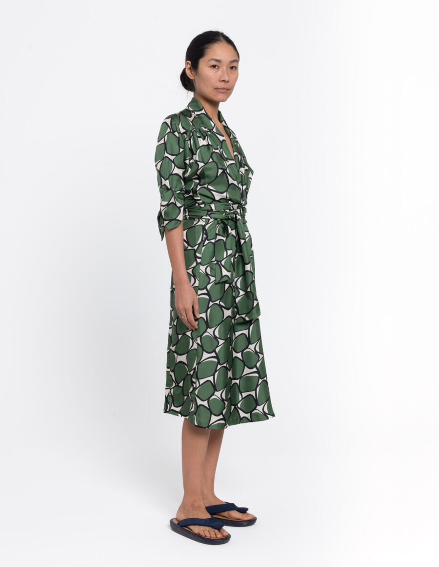Feminine dress with shawl collar in a geometric green and offwhite vintage print in silk twill