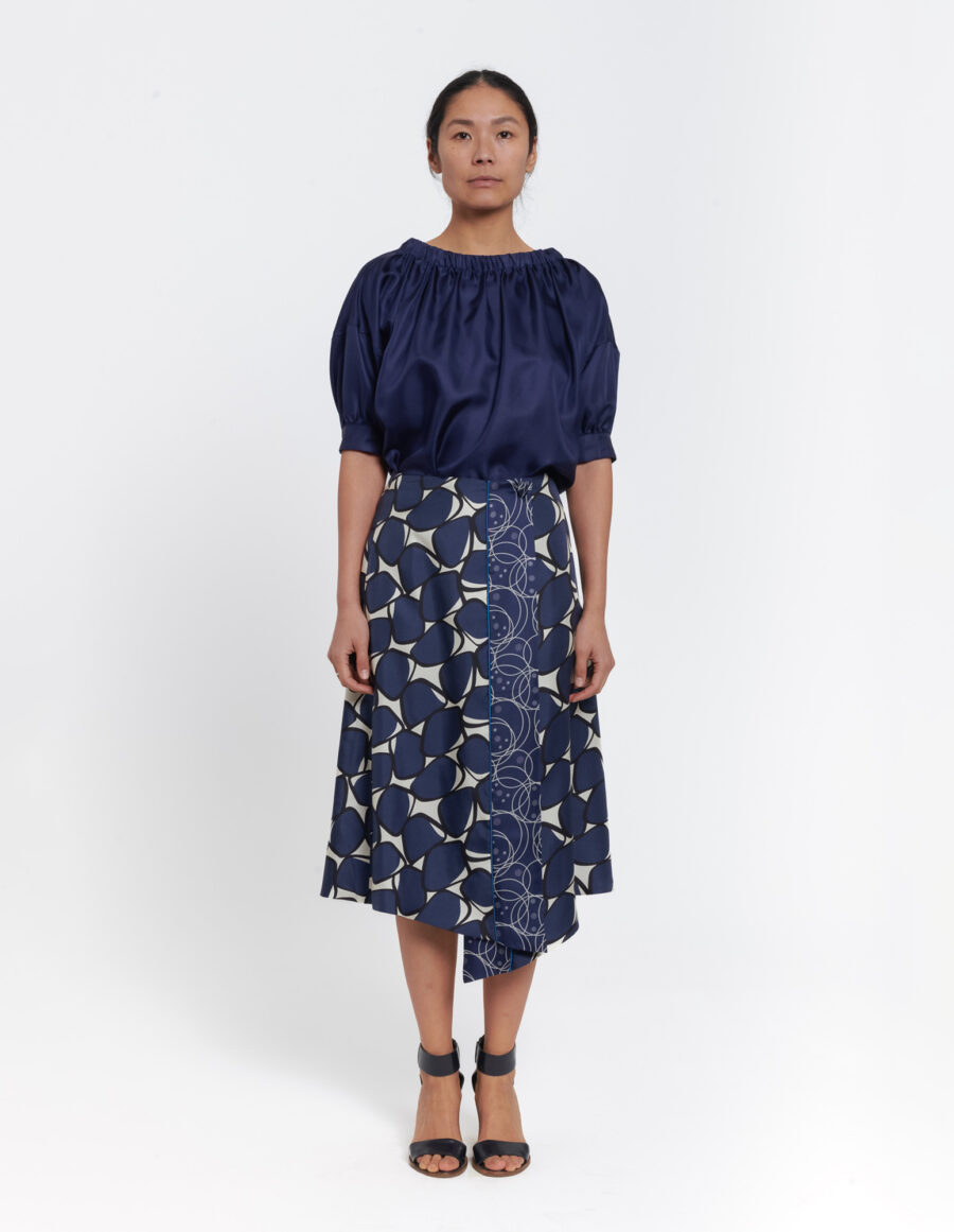 Wrap skirt with assymetric front in a geometric blue and offwhite vintage print in silk twill
