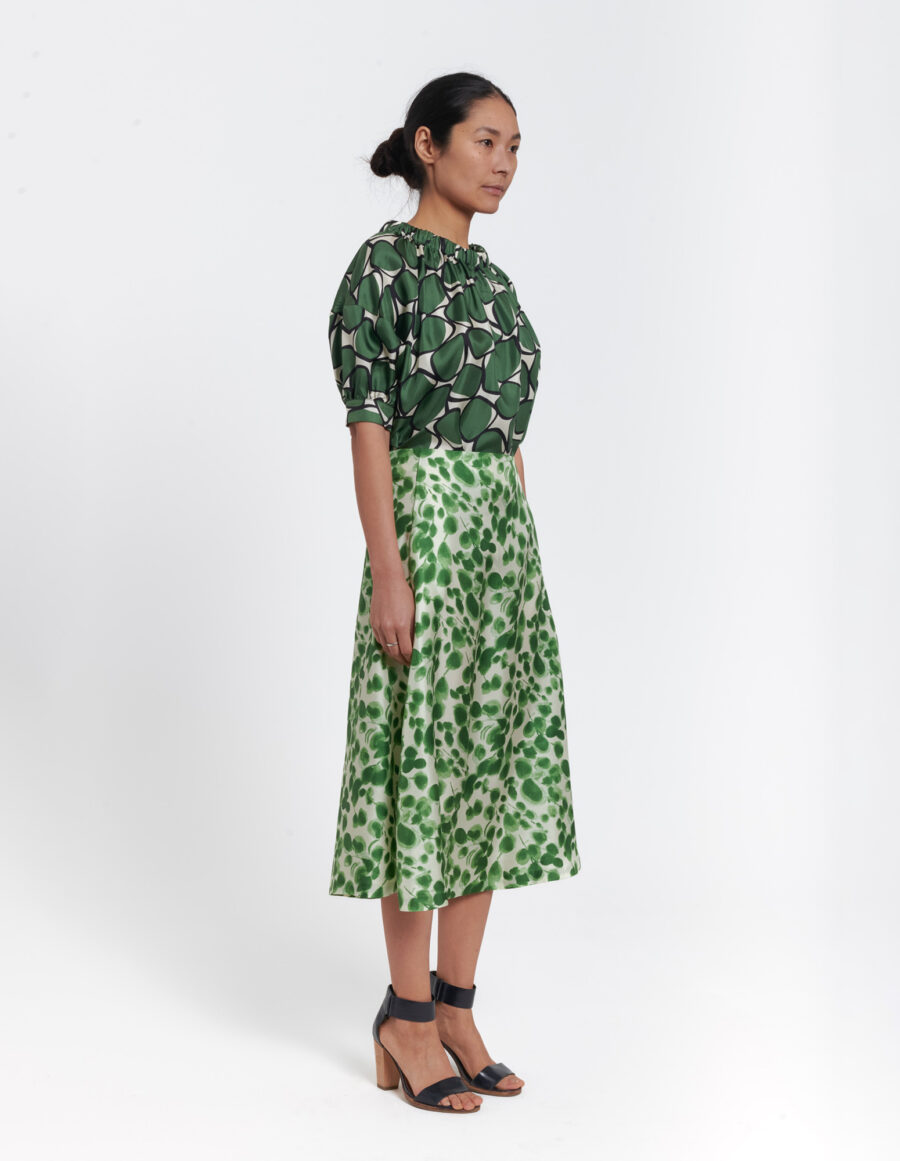 Feminine A-lined skirt in a geometric green and offwhite vintage print in silk twill