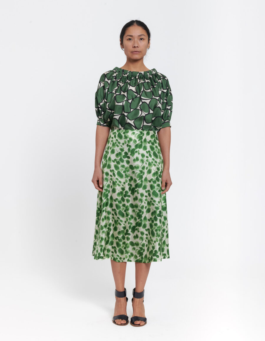 Feminine A-lined skirt in a geometric green and offwhite vintage print in silk twill